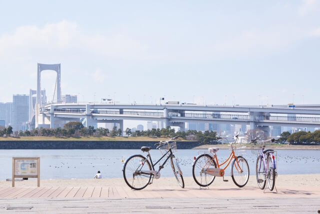 Bicycles parked in front of Rainbow Bridge, Tokyo