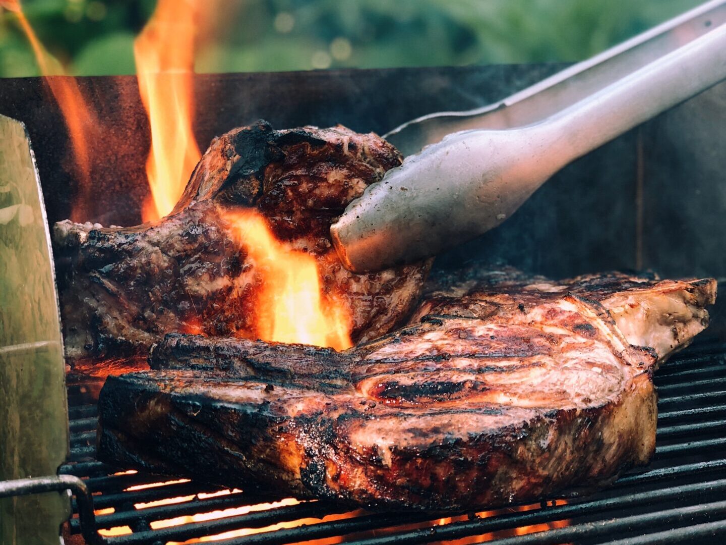 BBQ steaks with flames