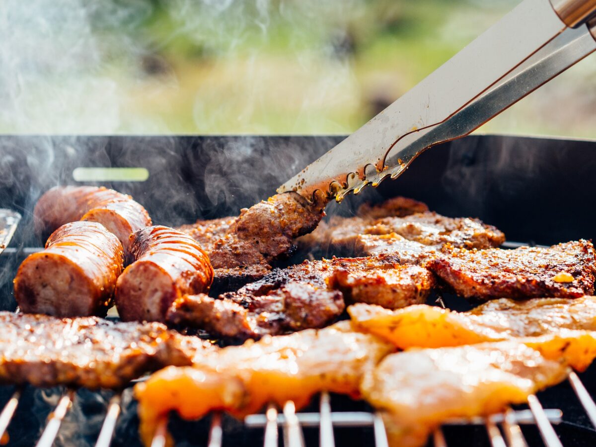 BBQ with tongs and smoke