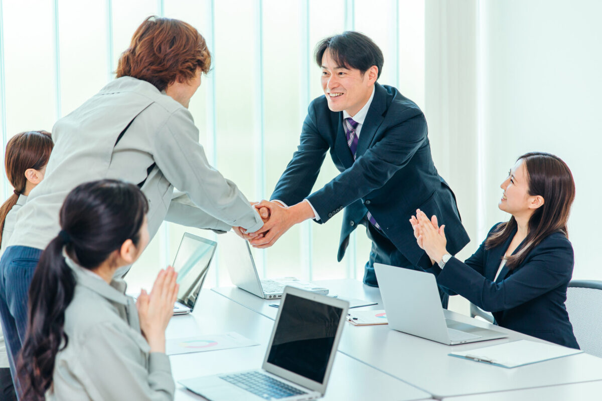 Shaking hands at meeting